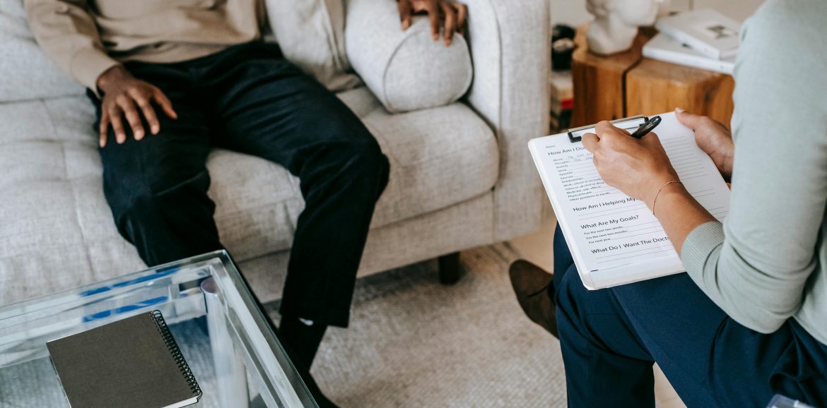 Client and therapist in session focused on psychodynamic and somatic therapy techniques