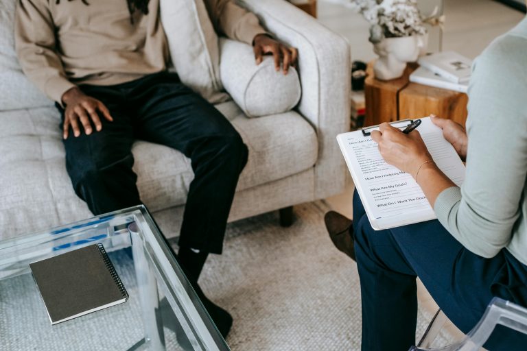 Client and therapist in session focused on psychodynamic and somatic therapy techniques